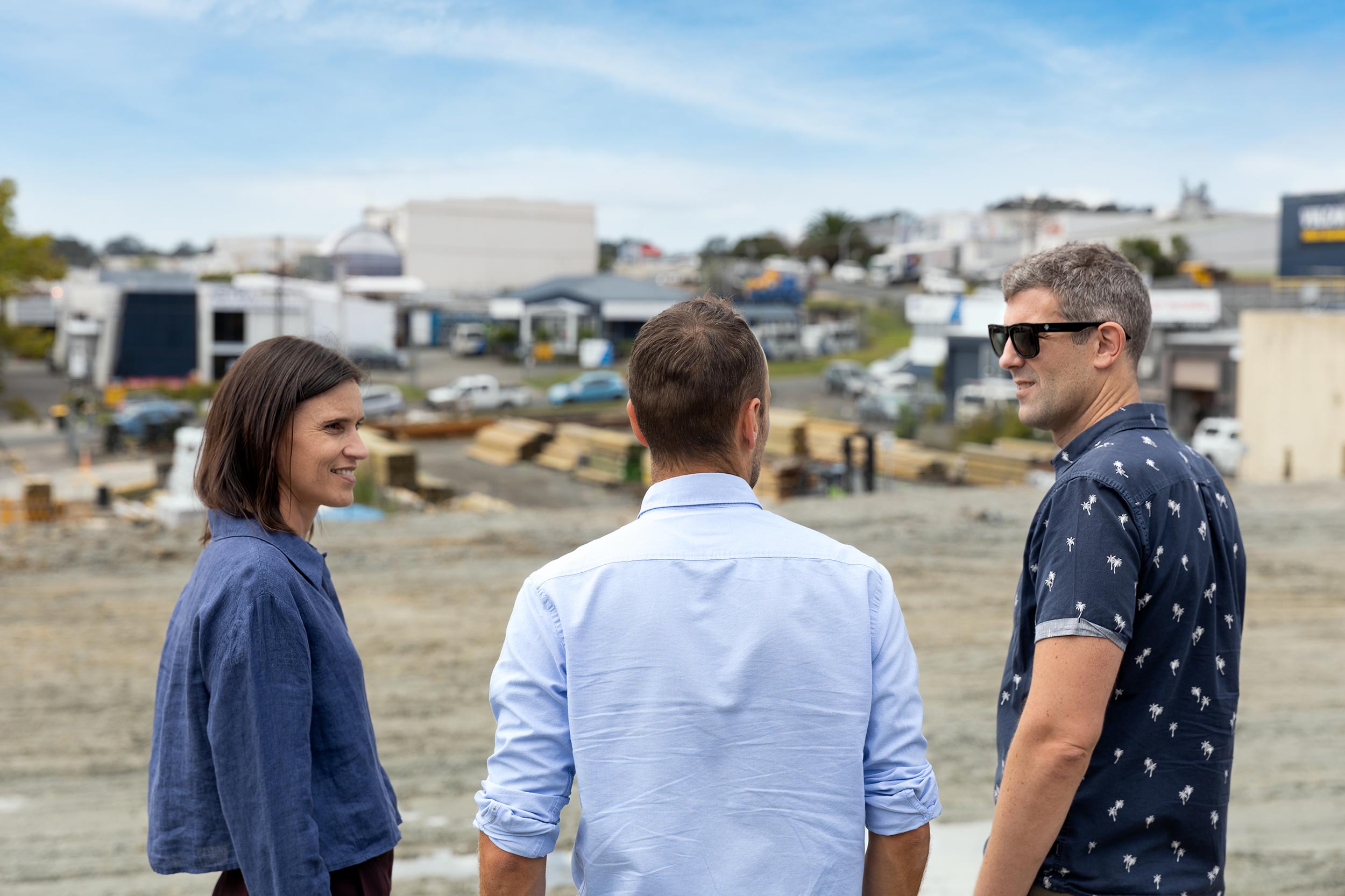 Lawyers and property developer on site discussing a project