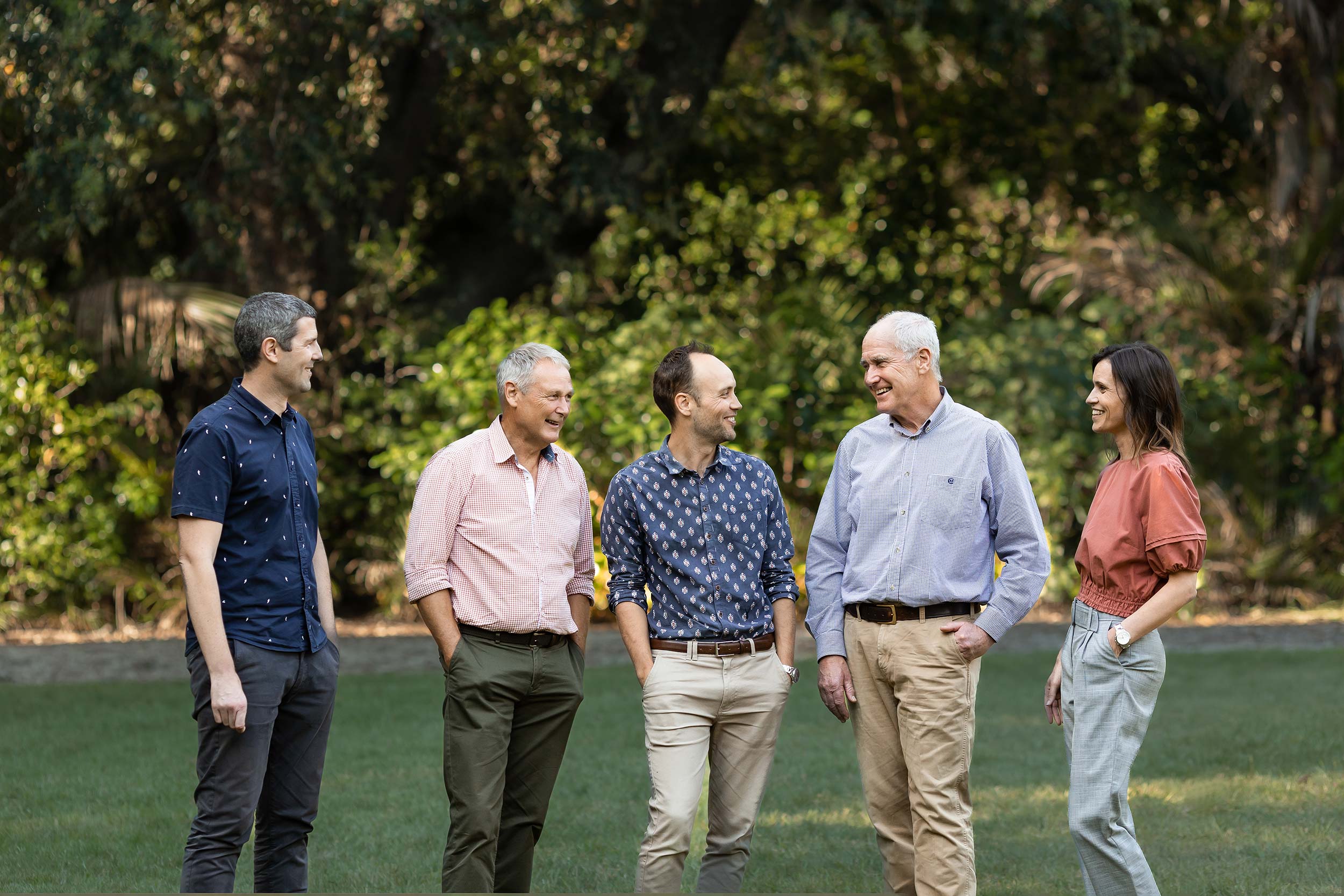 North Harbour Law Directors standing candidly in a park setting