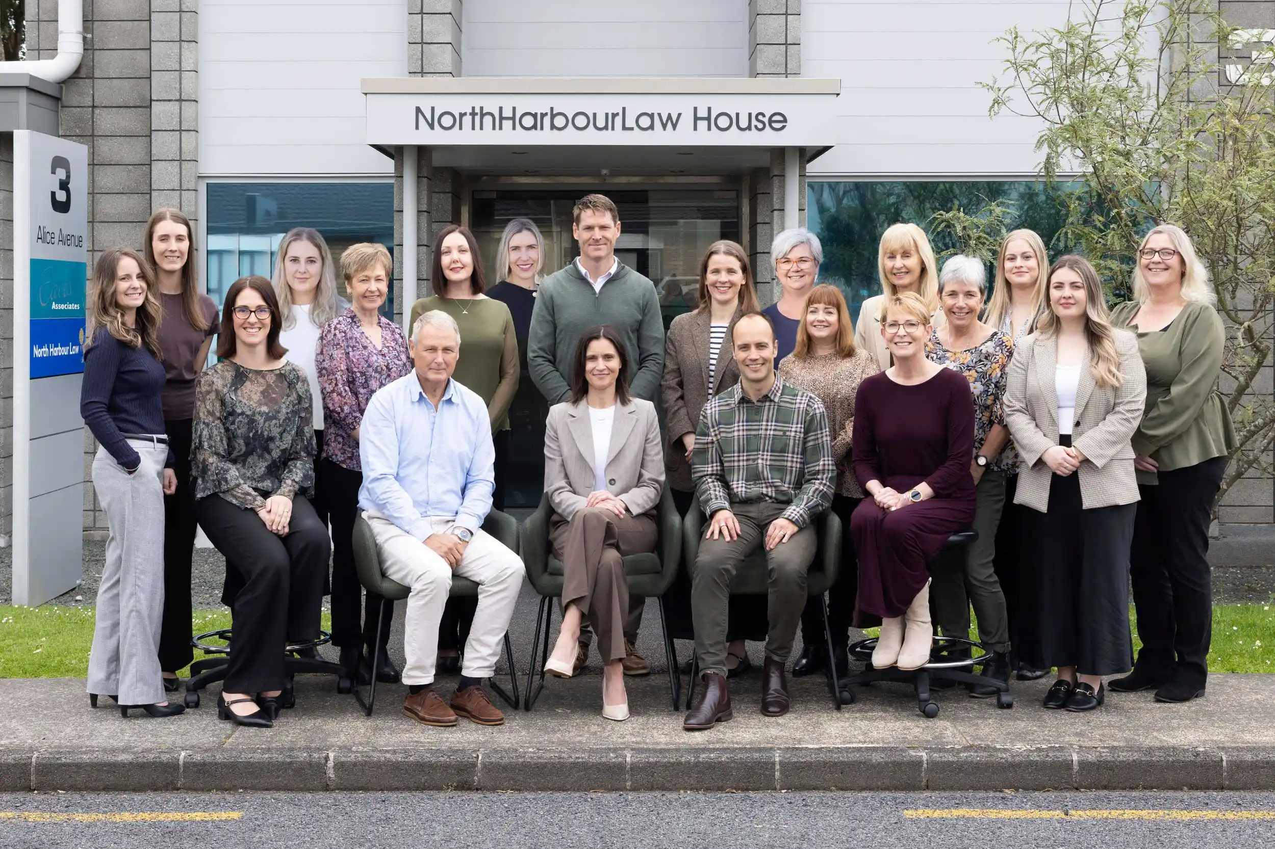 North Harbour Law staff group photo standing outside the front of the business