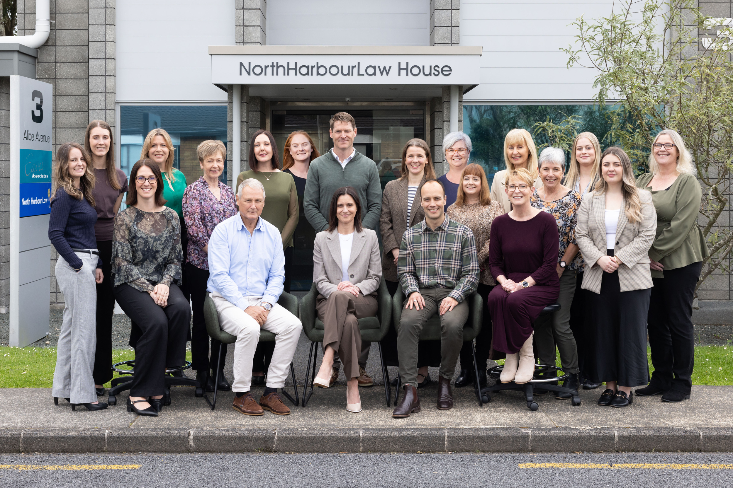 North Harbour Law staff group photo standing outside the front of the business