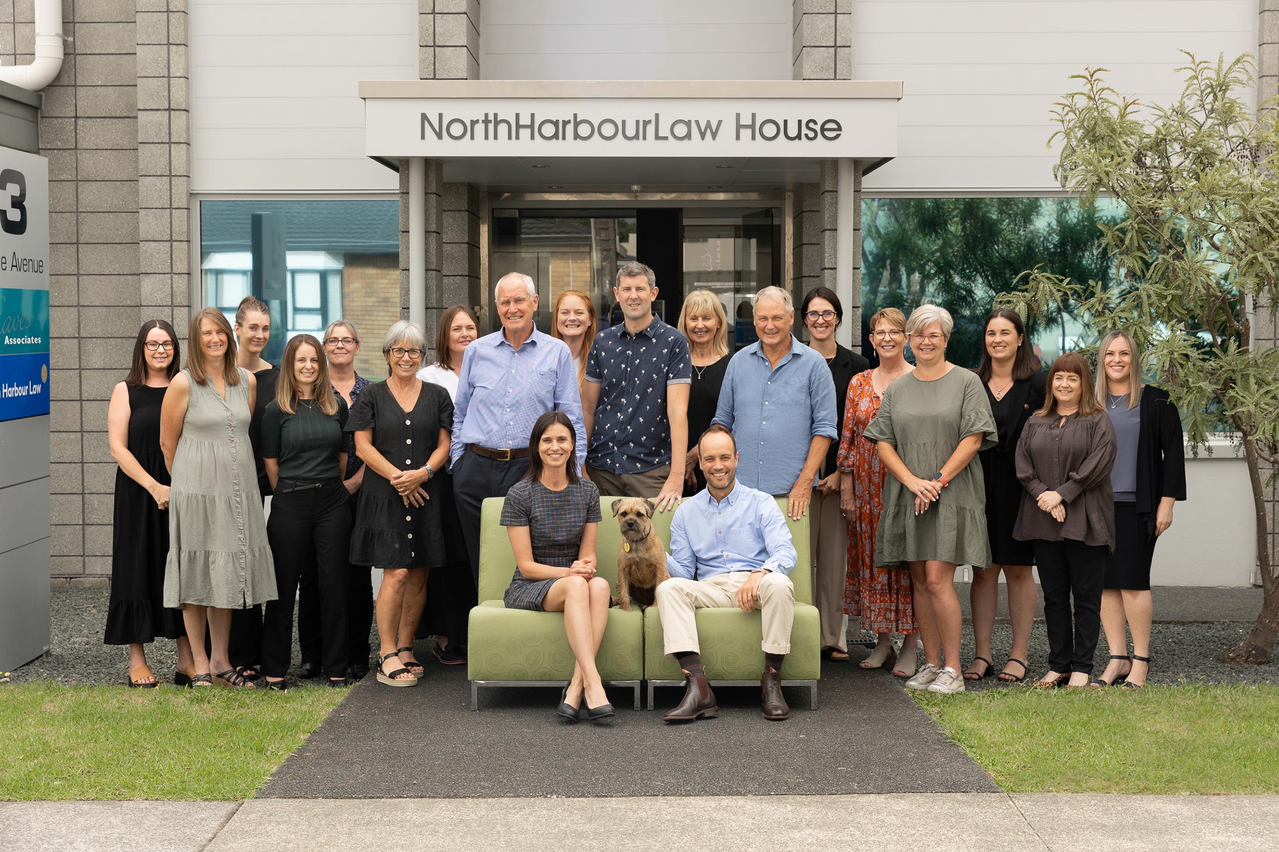 North Harbour Law staff group photo standing outside the front of the business